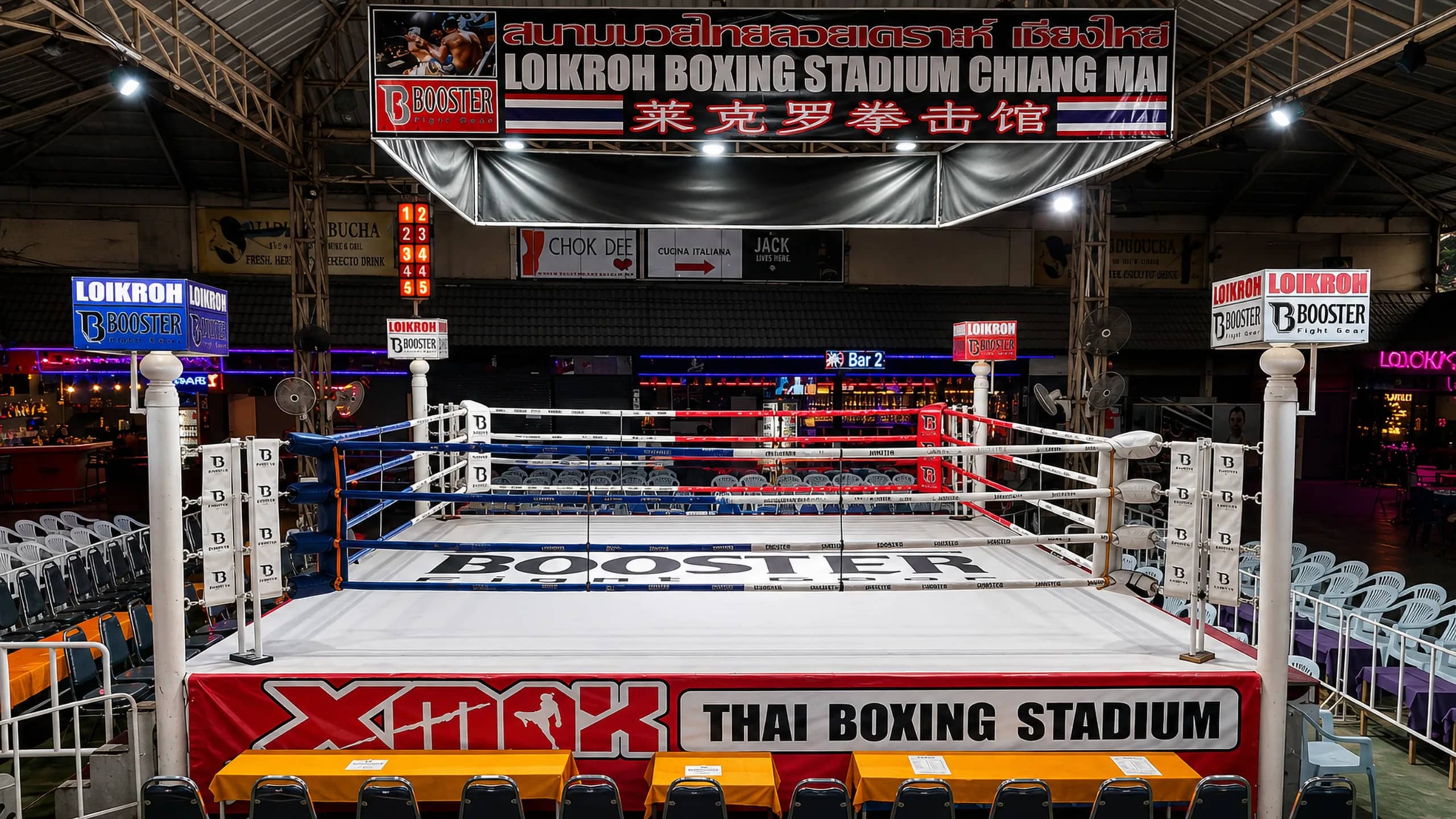 The boxing ring and ringside seats at Loi Kroh Boxing Stadium in Chiang Mai before the fights begin